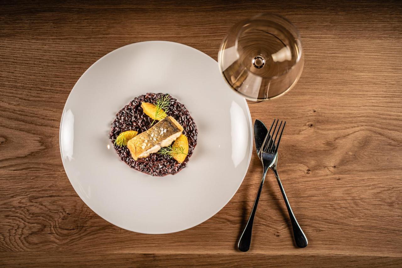 My Arbor - Dolomites Hotel Бресаноне Екстериор снимка A plate of black rice risotto